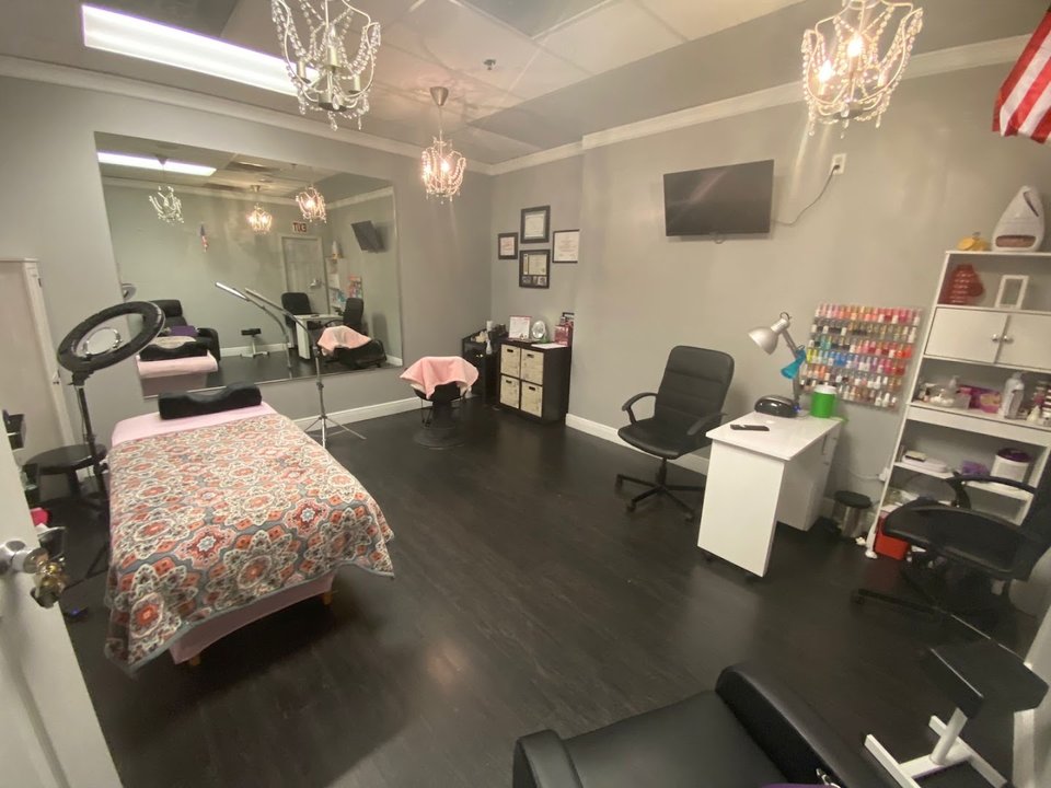 Salon chairs and manicure stations inside a beauty spa.