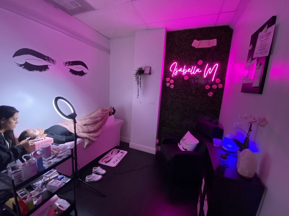Salon chairs and manicure stations inside a beauty spa.